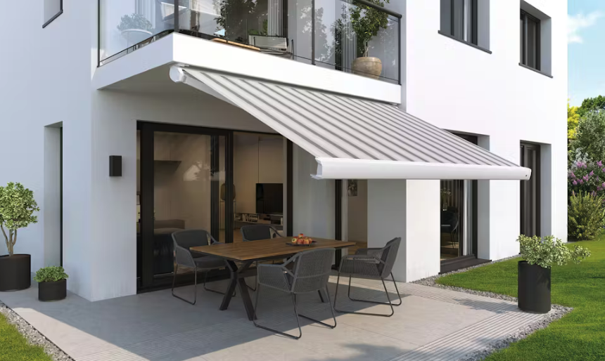 a light grey awning extended from the back of a white home