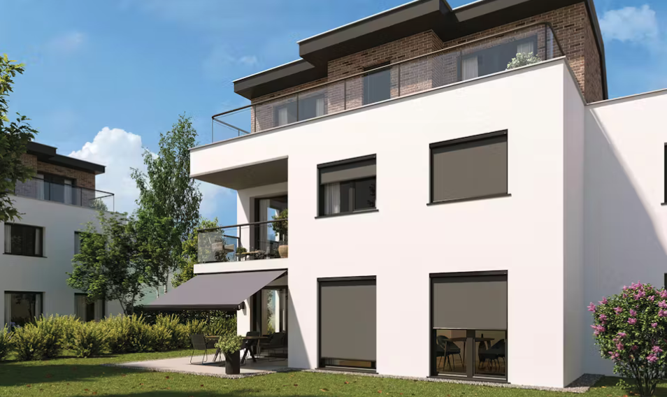 modern home with an awning extended over the back patio area